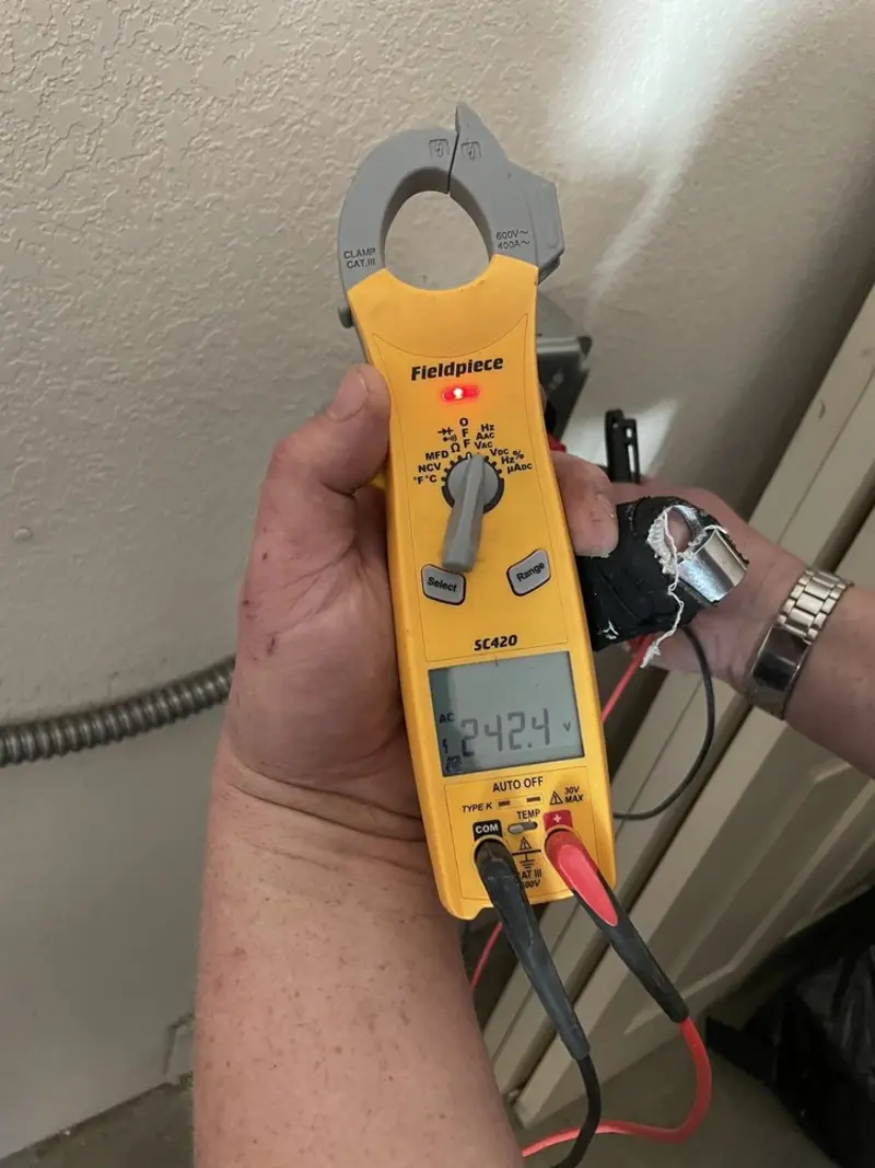 Voltage testing with clamp meter during Outlet Installation in Underhill